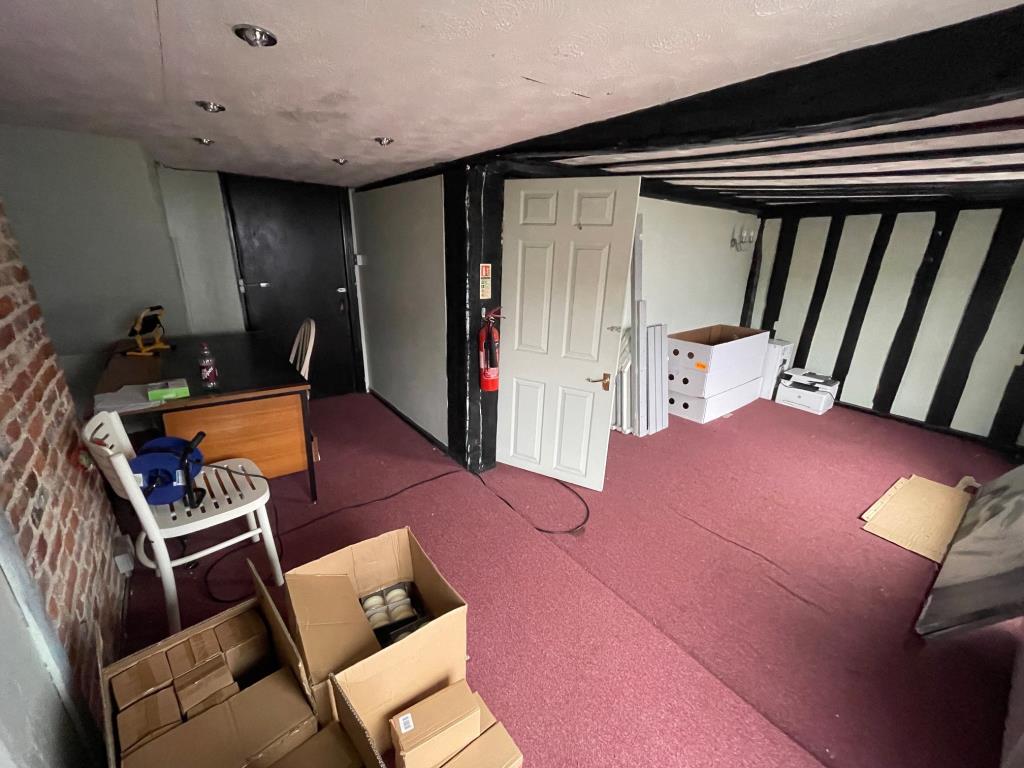 Lot: 82 - COMMERCIAL INVESTMENT WITH VACANT UPPER PARTS - Vacant upper room with exposed beams